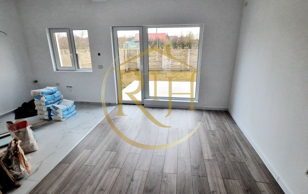 Duplex de vanzare cu 4 camere,2 bai,250 mp teren-Mosnita Veche zona Centrala.